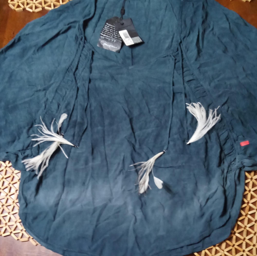 Very drippy women's blouse with tribal feathers